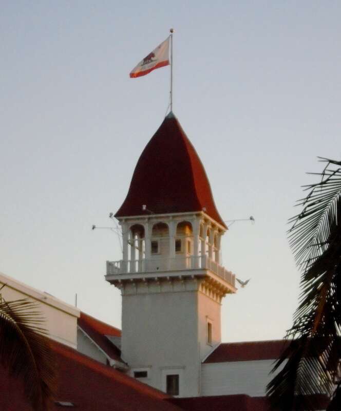 A tower of the Hotel del Coronado in Coronado, California at dusk.
