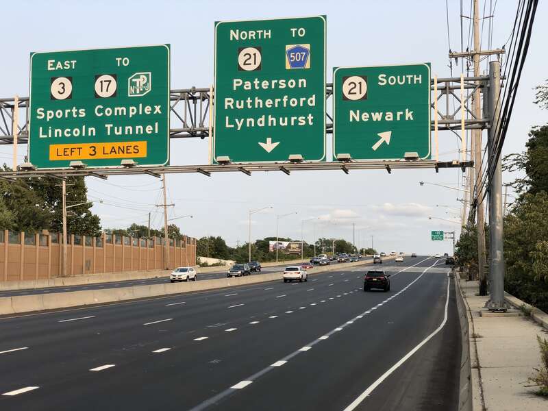 View east along New Jersey State Route 3 at the exit for New Jersey State Route 21 (TO Bergen County Route 507, Newark, Paterson, Rutherford, Lyndhurst) in Clifton, Passaic County, New Jersey