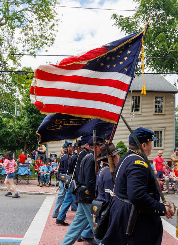 2nd Rhode Island Volunteers Co. B Reenactors carry a 34-star flag. 2023 Gaspee Days Parade, Pawtuxet Village, Rhode Island.