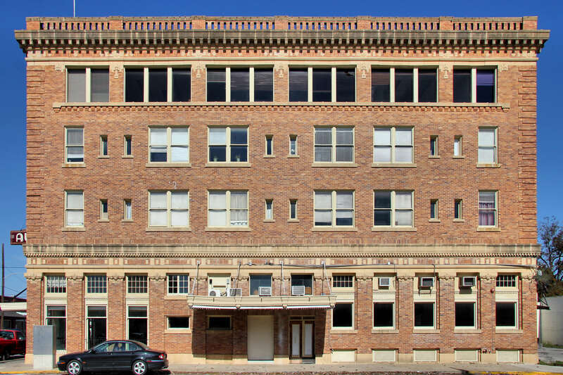 South elevation of the Aumont Hotel in Seguin, Texas, United States. Designed by prominent architect Atlee Ayers, the hotel opened in 1916. The Aumont was converted to residential apartments, office and commercial space. The Aumont was listed on the