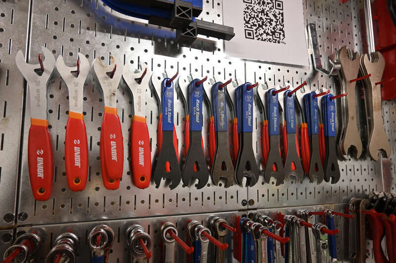 Bicycle cone wrenches of different sizes hanging on a tool wall at Somerville Bike Kitchen, a bike co-op in Somerville, Massachusetts.