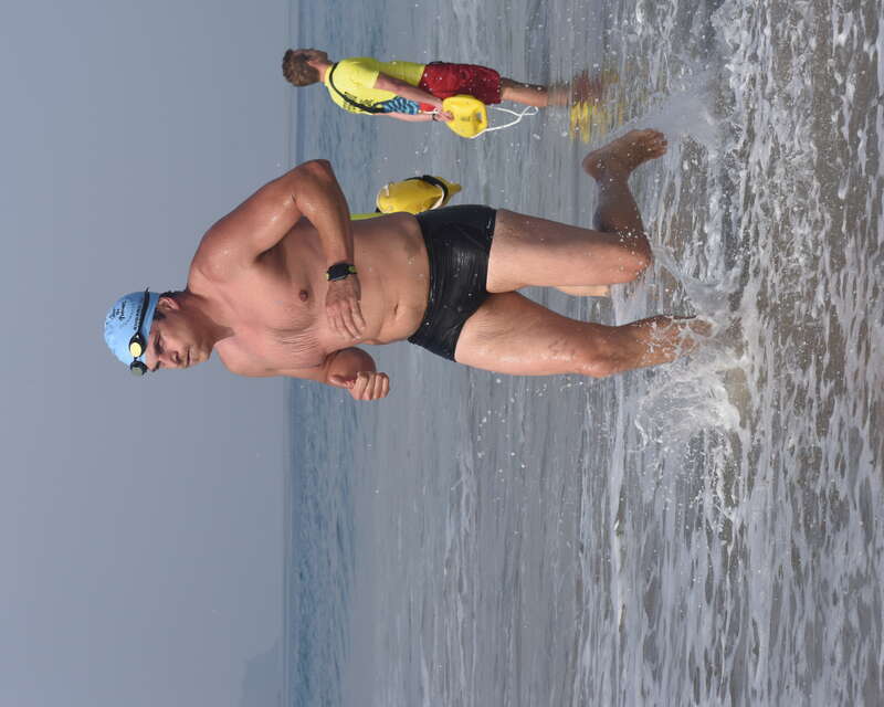 A man wearing a black Nike swim trunk exits the water after swimming the Second Annual Redondo Beach Open Water Swim held on Sunday, July 14, 2019.

VFJ_0308_cr