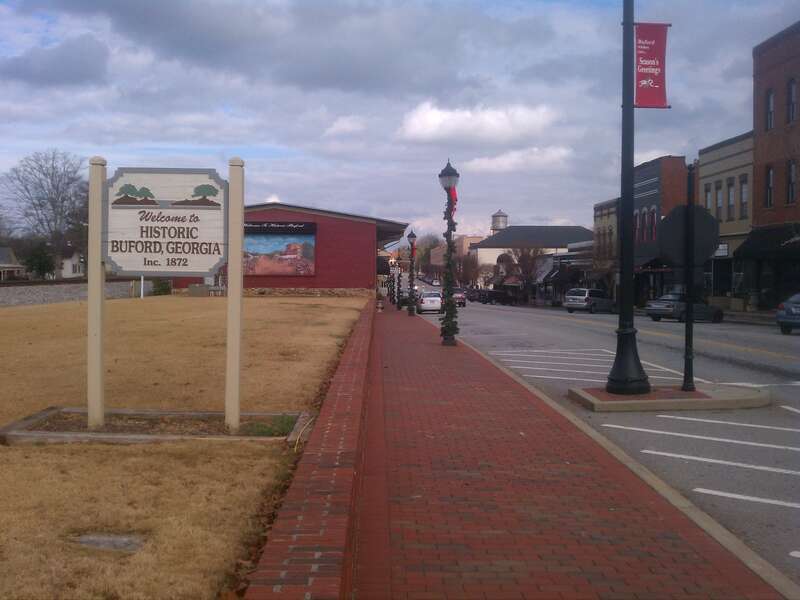 A photo of Main Street in Buford, Georgia including a "Welcome to Historic Buford, Georgia" sign.