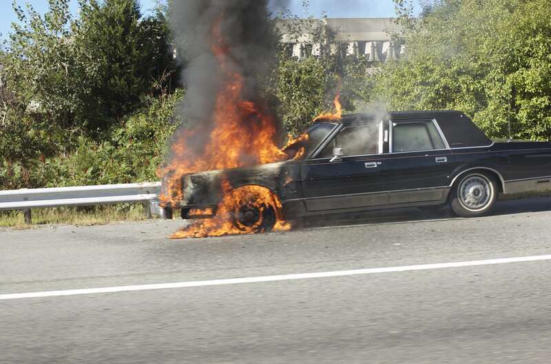 A car engine fire on the Massachusetts Turnpike (I-90).