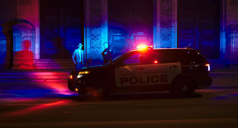 Carnegie Mellon University police vehicle at night.