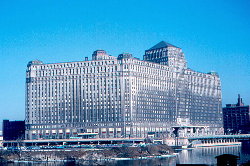 The Merchandise Mart was opened in 1930, after three years of construction.  It was the largest building in the world when it was opened.  It has 15 floors (20 in the tower).  Floor area is about 4 million sq.ft. (380,000 sq.m.).  About half of its