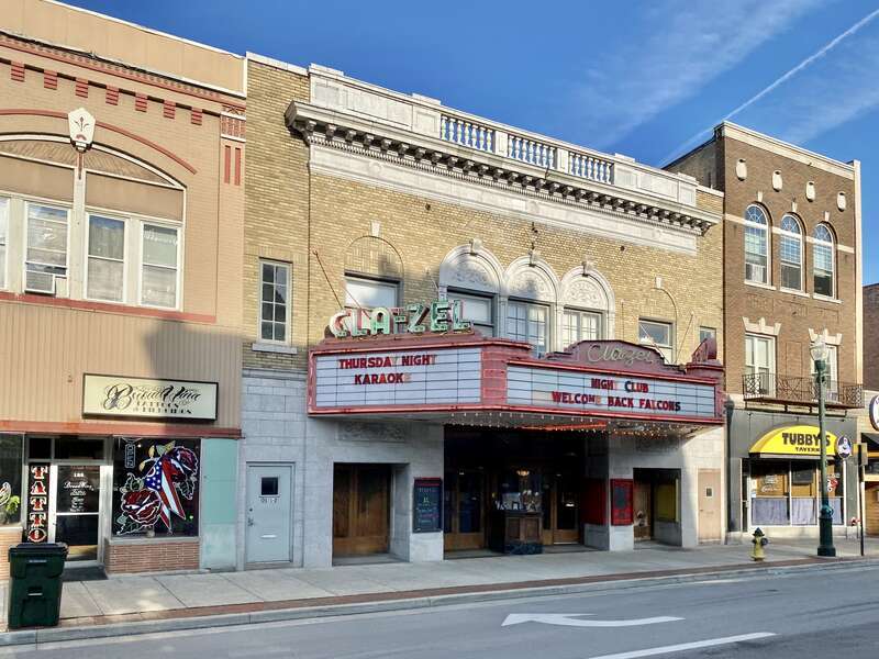 Built in 1926, this Renaissance Revival-style former movie theater was designed by Jack Raney.  The theater features a buff brick facade with second story windows featuring blind arches, a triple window over the front marquee with a limestone