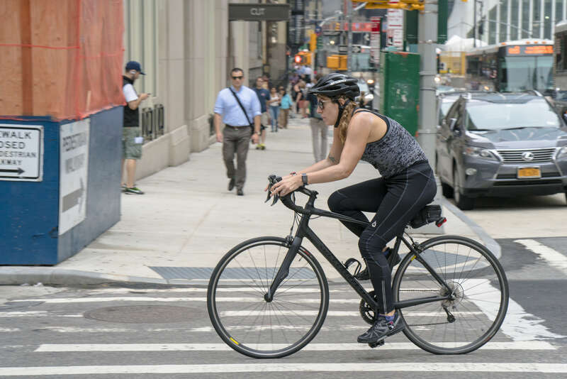A photo by Billie Ward.  (This work is licensed under a Creative Commons Attribution 4.0 International License.  Please provide attribution and a link back to this web page in a manner that associates the image with the image credit.)Cyclist riding