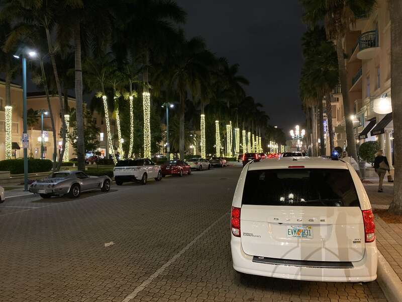 View of East Plaza Real (facing north) at night in Mizner Park, Boca Raton, Florida. Alsom the rear of a parked Dodge Grand Caravan (RT) with STX trim and finished in &quot;White Knuckle&quot; clear coat.