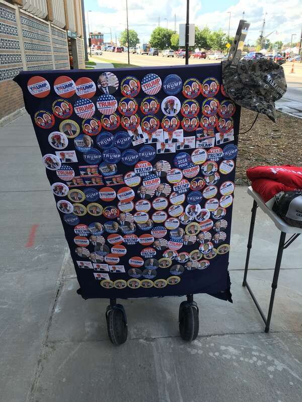 Trump signs at a rally at the KI Convention Center in downtown Green Bay, WI.