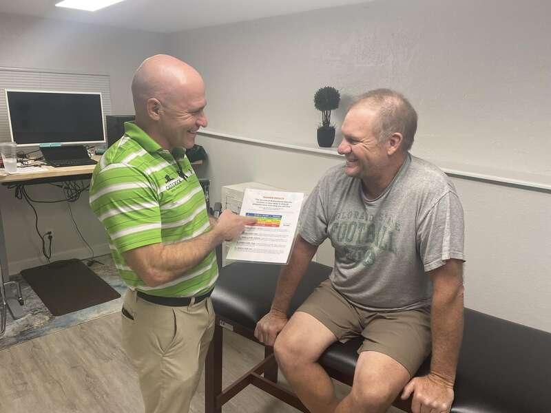 Dr. Lee Moorer At Castle Rock Mens Health with a person for Check Up