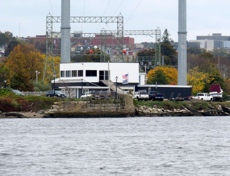 The remaining east abutment of the Slade's Ferry Bridge, viewed from across the river in October 2020