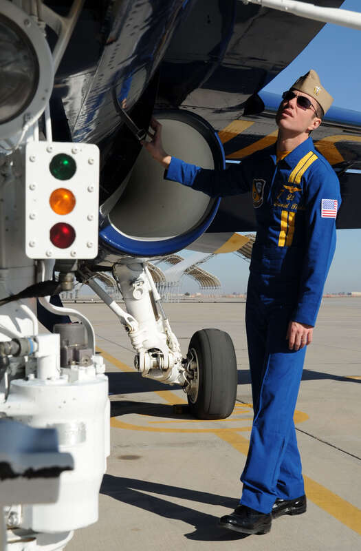 EL CENTRO, Calif. (Jan. 8, 2011) Lt. David Tickle, the pilot of Blue Angel number 7 and narrator for the 2011 Navy flight demonstration squadron, does a walk around inspection before conducting a functional check flight over Naval Air Facility El