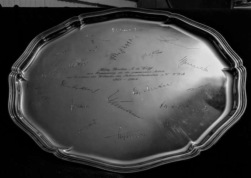 A silver platter, engraved with the signatures of the CEOs and Chairmen of German automobile manufacturers, was presented to Gaston de Wolff in the mid-1960s. The inscription states, in German, &quot;For Mr. Gaston A. de Wolff, in recognition of the