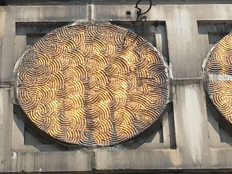 Gold Circle Detail at top of Chicago Merchandise Mart