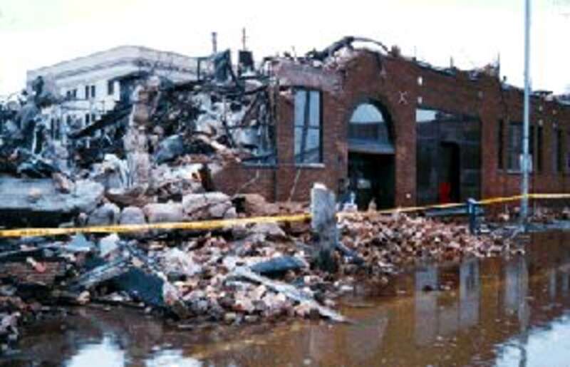 The remains of the en:Grand Forks Herald building a few days after it was destroyed by fire and floodwater during the 1997 Red River Flood.