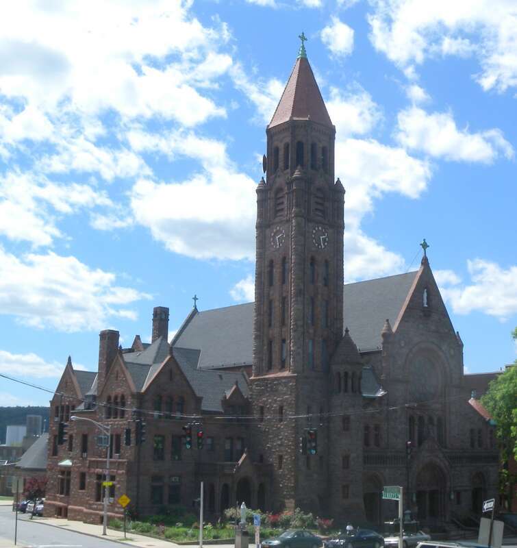 Looking west at Immaculate Conception of Mary Church from Police Headquarters grounds on a sunny early afternoon.