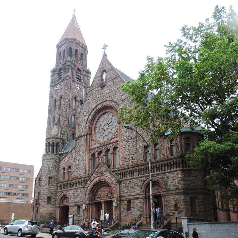 Looking southwest at church on a cloudy midday.