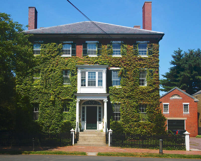 An ivy covered house in the Federal style, seen in Salem, Massachusetts.