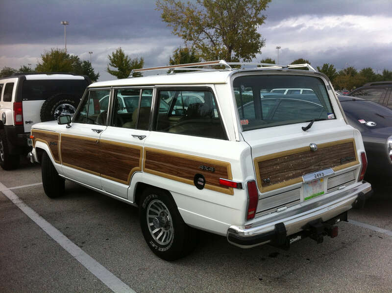 Jeep Grand Cherokee (SJ) finished in white - rear view of pioneering luxury SUV. Note: equipped with a class iV receiver for towing a trailer. Photographed in Orlando, Florida.