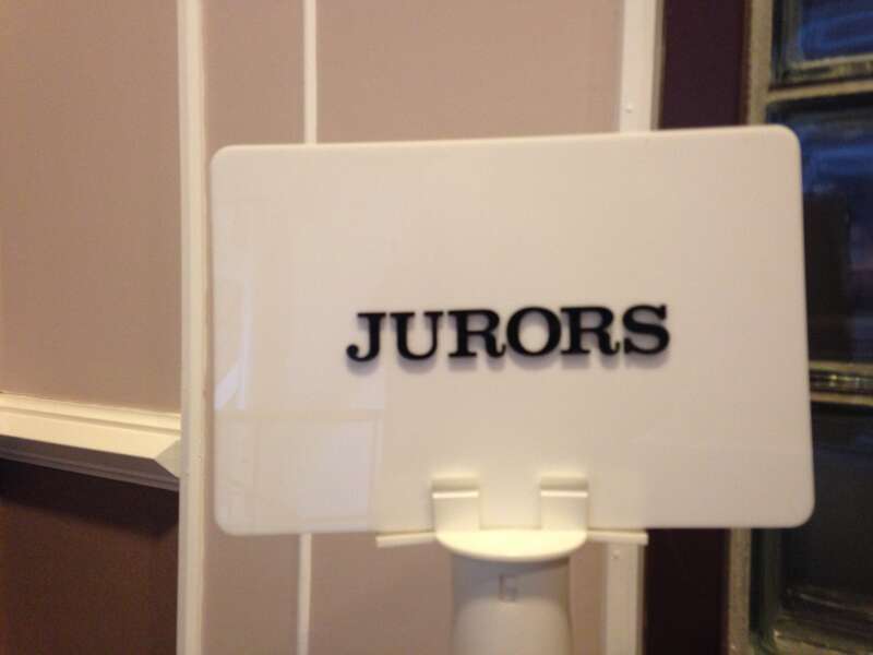 A sign indicating where jurors are to conjugate inside Hillsborough County Superior Courthouse in Nashua, New Hampshire.