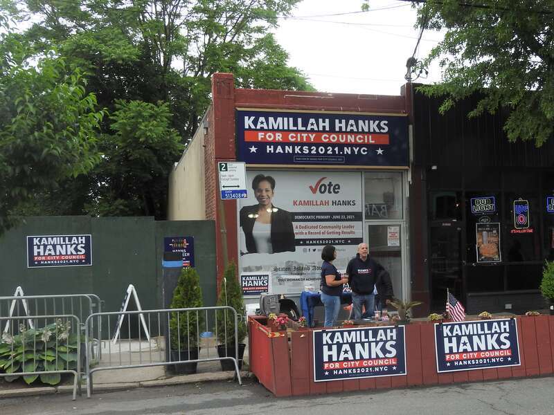 Looking north across Forest Avenue, at campaign office of candidate for City Council, on a cloudy day