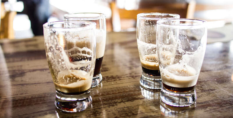 500px provided description: Trying out some of the dark stuff at the Knotty Barrel. [#empty ,#glasses ,#beer ,#samplers ,#knotty barrel]