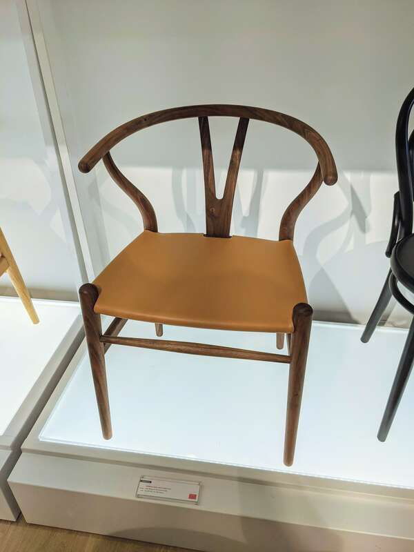 Hans J. Wegner's Wishbone Chair with a leather seat.