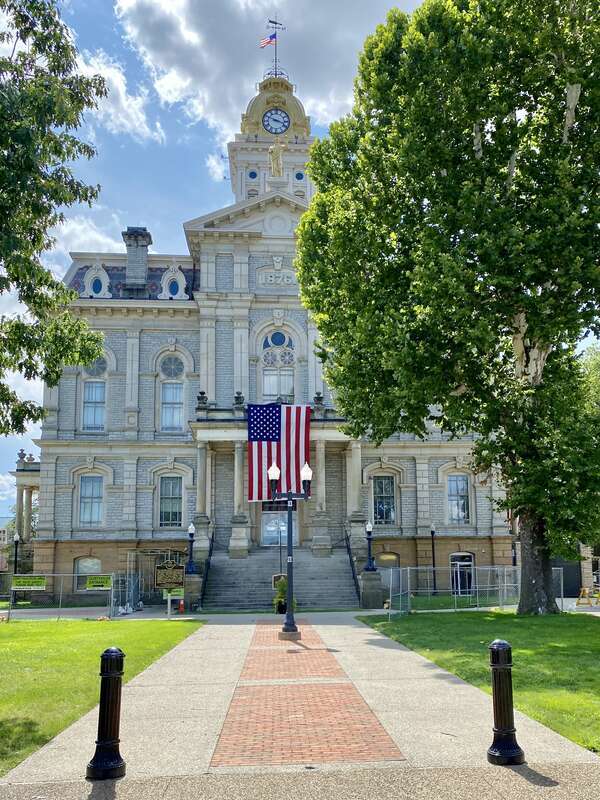 Built in 1876-1878, this Second Empire and Renaissance Revival-style courthouse was designed by H. E. Myer, and replaced a previous courthouse on the site that was destroyed by fire in 1876.  The building features a mansard roof, rusticated stone