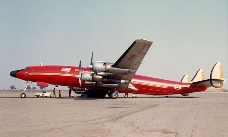 Willair International N8081H at Stockton, California, on September 29, 1968. The right gear collapsed upon landing on the 28th and the right inboard engine nacelle caught fire. This photo was taken after it had been moved near the Tower.