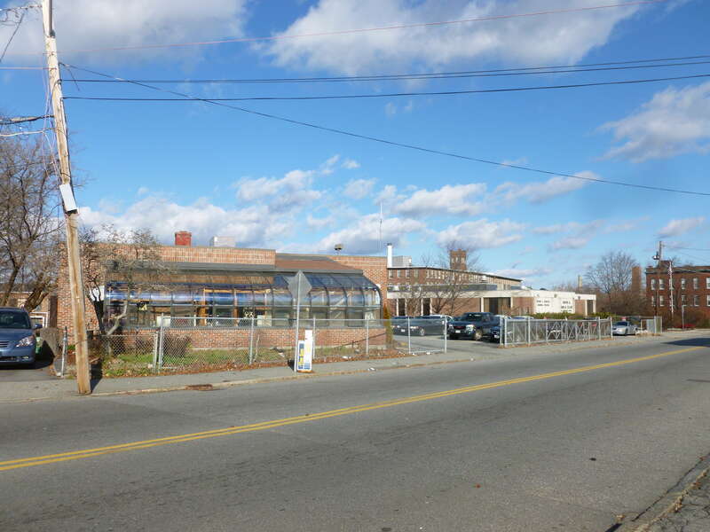 Lower Highlands precinct station of the Lowell Police Department.  West and south sides of building shown.  The Boys &amp;amp; Girls Club of Greater Lowell is visible in the background.