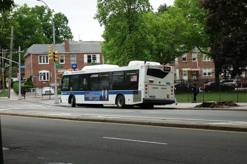 A College Point-bound Q20B bus (currently out-of-service) laying over in front of John Bowne High School at Main Street and Reeves Avenue in Queensboro Hill / Pomonok, Flushing Queens. This bus will become one of the special &quot;school tripper&quot; buses