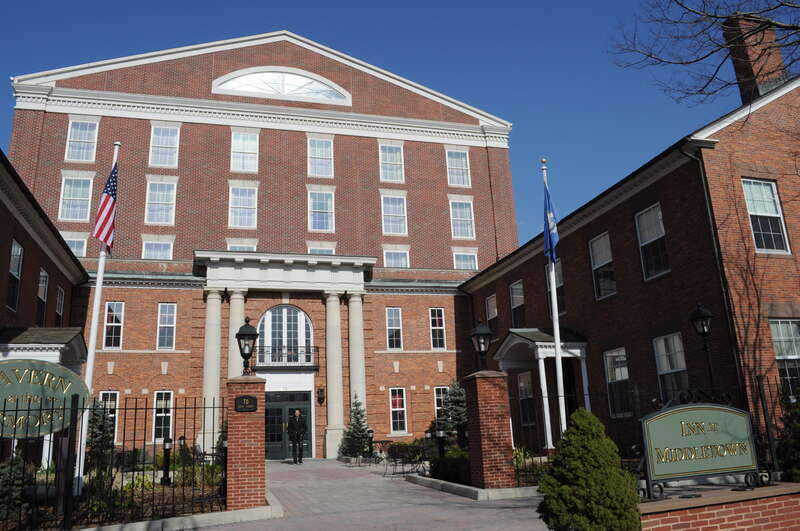 Inn at Middletown (former State Armory), 70 Main Street, Middletown, Connecticut, USA.  The U-shaped combination building, built 1921, incorporates the John R. Watkinson House, built c. 1810 as its north arm (on the left as you are facing it); the
