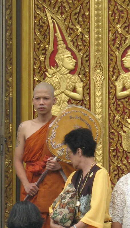Monk with fan