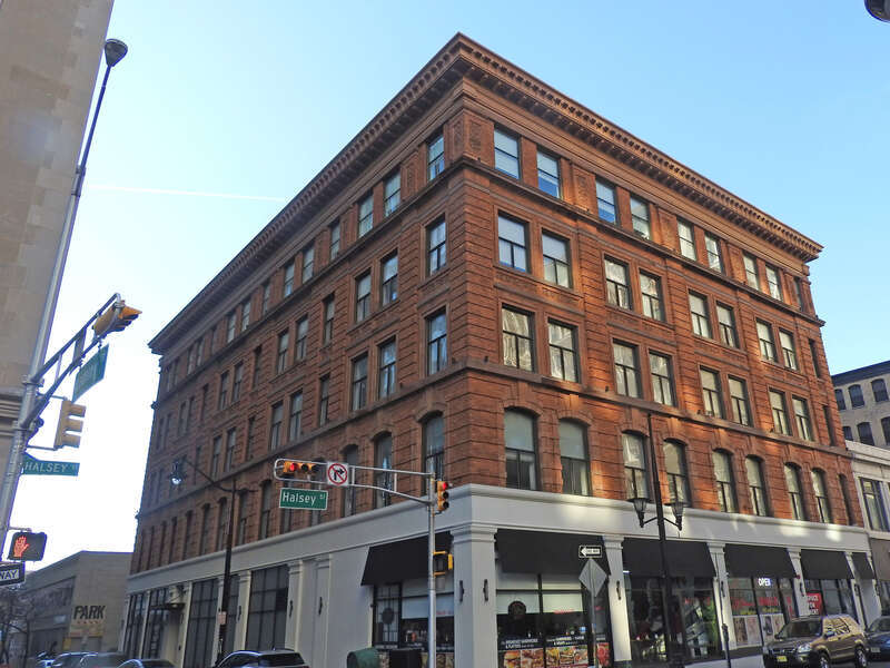 Looking north across Academy and Halsey Streets at an old building in Newark