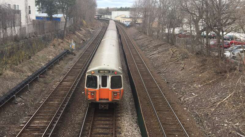 A northbound Orange Line train just north of Clifton Street in Malden in April 2018