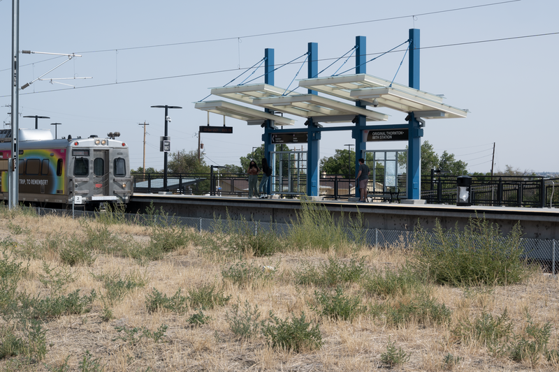 Original Thornton &amp;amp; 88th RTD station viewed from west. In foreground a southbound RTD commuter rail train is arriving.