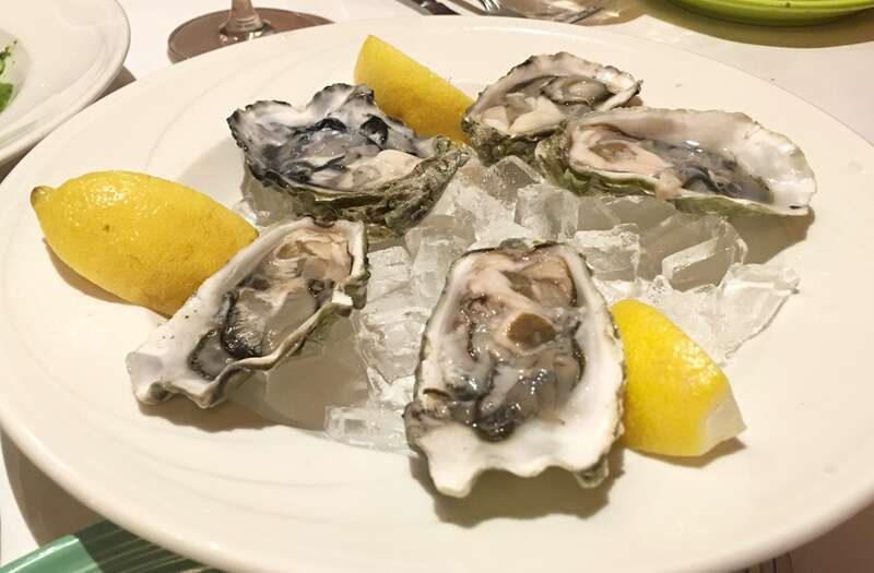 Picture of Oysters served on ice in an Italian Restaurant.