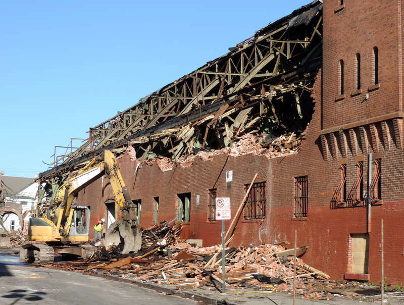 Looking northeast across Rosa Parks at the armory with western wall partly demolished in early afternoon.