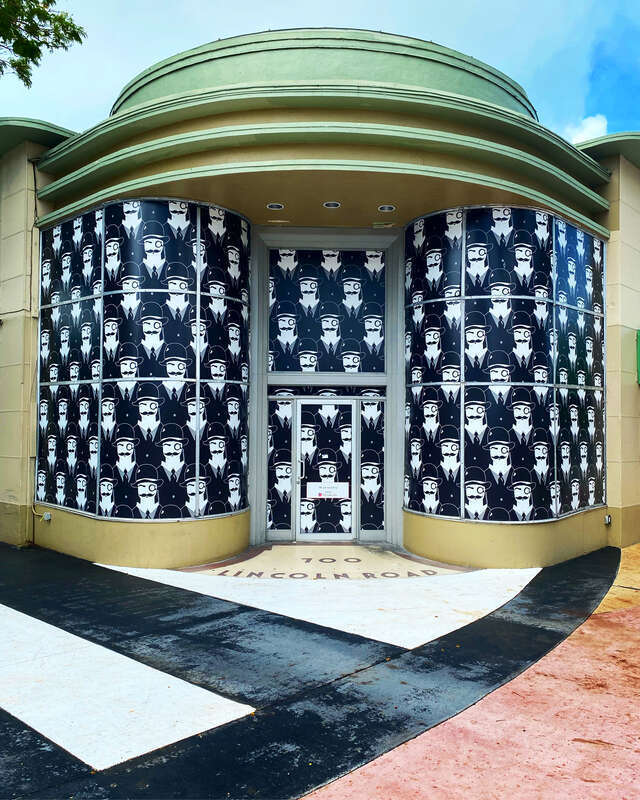 Monocle Man people watching on Lincoln road. The Seymour Building, 700 Lincoln Road, Miami Beach.