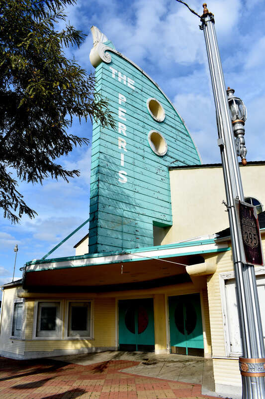 Perris Theater, used as a church in the 1980s; originally built as an open-air venue, covered during World War II, renovated 2010-2011; often referred to locally as &quot;The Chief&quot;, due to its use during the shooting of the film Calendar Girl (1993) in