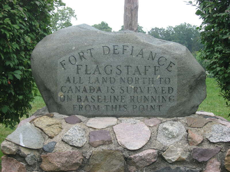 Front of a Point of Beginning at the site of Fort Defiance, located atop a bluff overlooking the confluence of the Auglaize and Maumee Rivers in Defiance, Ohio, United States.  Built in 1794, the fort served as U.S. Army headquarters before the