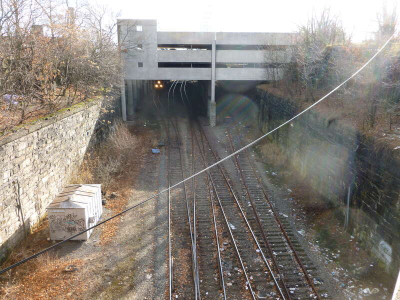Railroad tracks under the Rourge Parking Garage.  Picture taken from the bridge at Chelmsford Street that overpasses the Lowell MBTA Line railroad tracks.