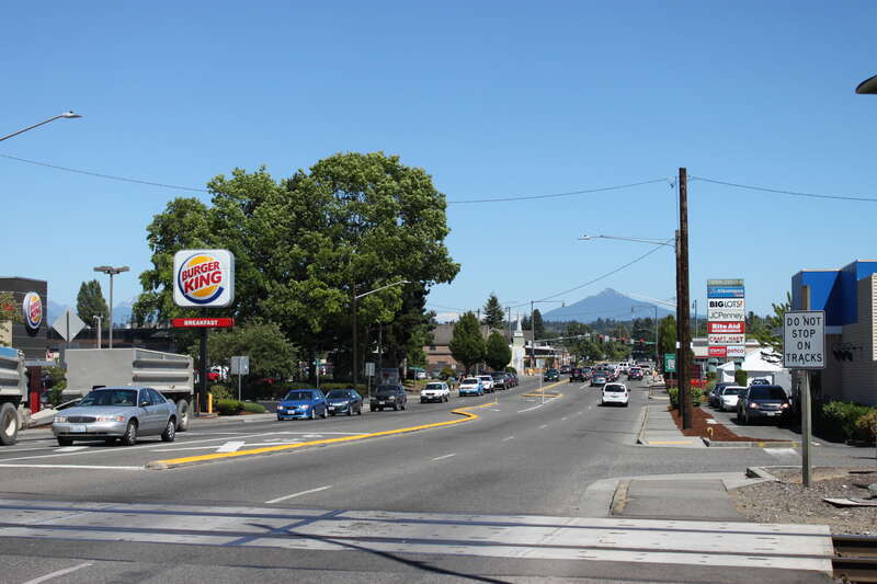 State Route 528 eastbound at a railroad crossing in Marysville, Washington.