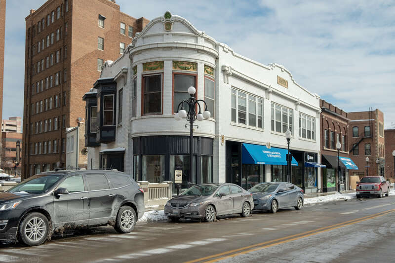 White brick building on the river