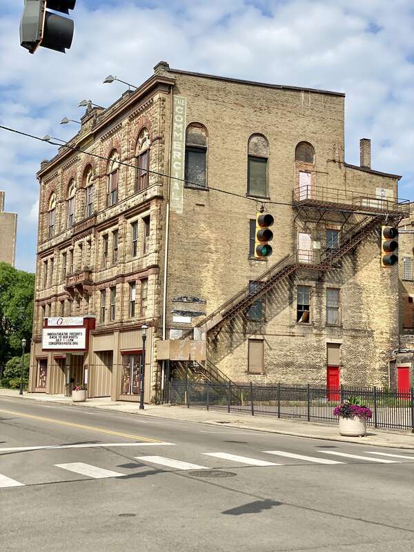 Built in 1890, this Richardsonian Romanesque Revival-style building was designed by Samuel Hannaford for Paul J. Sorg to serve as an opera house.  The building features a brick exterior with a rough-hewn stone front facade, arched window bays on the