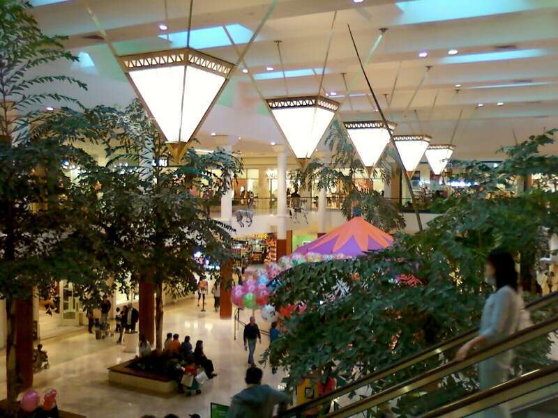 View of the Carousel Courtyard at South Coast Plaza shopping mall. This photograph was taken with a Samsung Reclaim SPH-m560 mobile phone camera and edited (bright, contrast and color balance) using ArcSoft PhotoStudio 5.5.