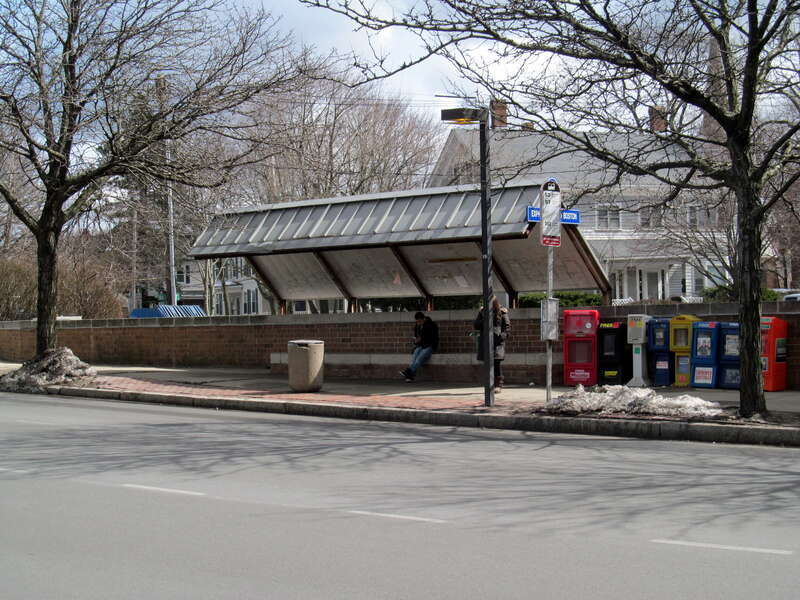 The south side bus stop at Newton Corner, serving the 52, 57, 502, 504, 553, 554, 556, and 558 routes, in March 2013