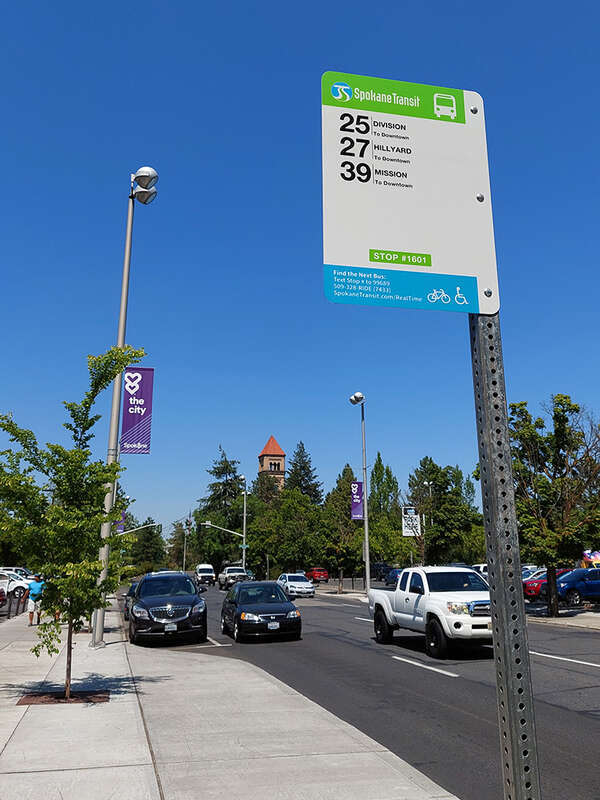 Typical bus stop sign of Spokane Transit Authority in Spokane, Washington at a stop featuring a bus bulb.