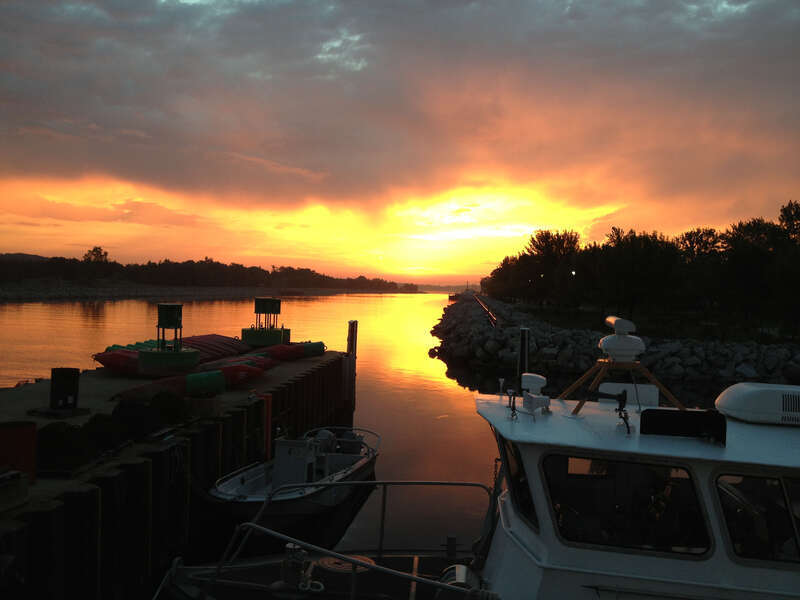 Sunrise on the Muskegon Lake channel, June 2013. Credit: NOAA.